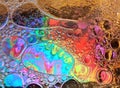 Rainbow background with bubbles, texture of water and oil drops Royalty Free Stock Photo