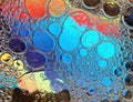 Rainbow background with bubbles, texture of water and oil drops Royalty Free Stock Photo