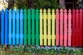 Rainbow background, fence in the garden