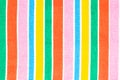 Rainbow backgrounds fabric. Closeup of rainbow textile with fresh colorful textured parallel vertical stripes. Abstract summer