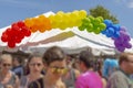A rainbow balloon banner on top of a tent at the Pride Festival Royalty Free Stock Photo