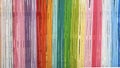 Rainbow Bamboo Wall In the bright concept of a long segmented bamboo wall painted in multi-colored Use it as a background or Royalty Free Stock Photo