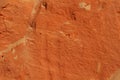 Orange sand texture background of the colored sand cliffs of Rainbow Beach, Australia