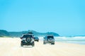 4wd vehicles at Rainbow Beach with coloured sand dunes, QLD, Australia Royalty Free Stock Photo