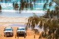4wd vehicles at Rainbow Beach with coloured sand dunes, QLD, Australia Royalty Free Stock Photo
