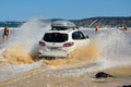 4WD Hyundai car driving across a washout in Queensland Royalty Free Stock Photo