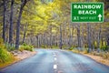 RAINBOW BEACH road sign against clear blue sky Royalty Free Stock Photo