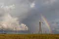 Rainbow behind wind turbines Royalty Free Stock Photo