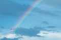 Rainbow on a blue evening sky with clouds Royalty Free Stock Photo