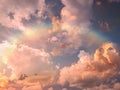 Rainbow at blue pink sunset sky fluffy clouds and sunlight beams skyline  nature landscape weather forecast Royalty Free Stock Photo