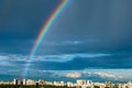 Rainbow in the blue sky after a thunderstorm over the city Royalty Free Stock Photo