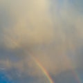 Rainbow in blue sky with white cloud after rain Royalty Free Stock Photo