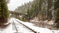 Rainbow bridge in Idaho with train tracks in winter Royalty Free Stock Photo