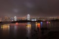 Rainbow bridge at night in Daiba district in Tokyo Japan