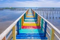 Rainbow bridge in Thailand.View of The colorful wood bridge extends into the sea under blue sky at samut sakhon province,Thailand Royalty Free Stock Photo