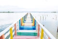 Rainbow Bridge in Thailand - Perspective View of a Colorful Wood Bridge and Wooden Pier Royalty Free Stock Photo