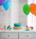 Rainbow cake and cupcakes on the Birthday party Royalty Free Stock Photo