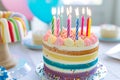 Rainbow cake with whipped cream top. Birthday cake with multicolored. Colorful rainbow birthday cake with colorful rainbow