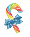 Rainbow candy cane with blue bow isolated on white background.