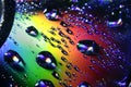 Rainbow on the CD with water drops