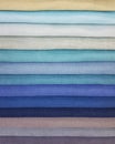 Rainbow clothes stack. Bright colourful fabric Royalty Free Stock Photo