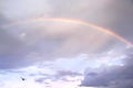 Rainbow  cloud on light blue sky background after rain in the evening Royalty Free Stock Photo
