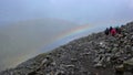 Hikers on Ben Nevis in Scotland with a rainbow Royalty Free Stock Photo