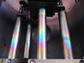 Rainbow on coated steel rods inside vacuum deposition chamber Royalty Free Stock Photo