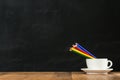 Rainbow color pencils in the white coffee cup Royalty Free Stock Photo