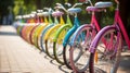 Rainbow-colored bicycles parked in a row