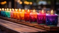 Rainbow-Colored Candles Illuminating Glass Jars