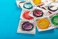 Rainbow of colored condoms on background. Royalty Free Stock Photo