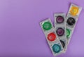 Rainbow of colored condoms on background. Royalty Free Stock Photo