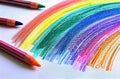 Rainbow of Colored Crayons on White Surface Royalty Free Stock Photo