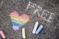 rainbow colored heart is drawn with chalk on the asphalt.. lgbt symbol, pride concept Royalty Free Stock Photo