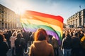 People with rainbow colored LGBTQ flag in demonstration or pride march Royalty Free Stock Photo
