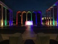 Rainbow colored lights illuminating the colonnade of Lincoln Center