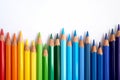 Rainbow colored pencils are jiggling side by side. Royalty Free Stock Photo