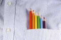 Rainbow of colored pencils in shirt pocket Royalty Free Stock Photo