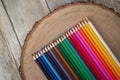 Rainbow of colored pencils on wood background Royalty Free Stock Photo