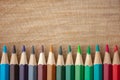 Rainbow of colored pencils on wood background Royalty Free Stock Photo