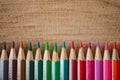 Rainbow of colored pencils on wood background Royalty Free Stock Photo