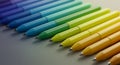 Rainbow Colored Pens Arranged in a Row Royalty Free Stock Photo