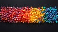 Rainbow Colored Plastic Granules on Dark Background Royalty Free Stock Photo