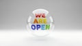 Rainbow colored text WEAREOPEN inside a clear glass sphere we are open Royalty Free Stock Photo