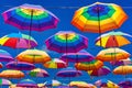 Low Angle View Of Rainbow Colored Umbrellas Hanging On The Background Of A Blue Sky Royalty Free Stock Photo