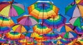 Low Angle View Of Rainbow Colored Umbrellas Hanging On The Background Of A Blue Sky Royalty Free Stock Photo