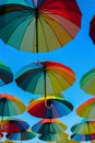 Rainbow colored umbrellas hanging on the sky vertical image Royalty Free Stock Photo