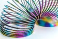 Russia, Severodvinsk, Rainbow colored wire spiral toy on white background. Selective focus Royalty Free Stock Photo