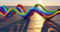 Rainbow colored wires twisted into a wave shape against a sunset sky background Royalty Free Stock Photo